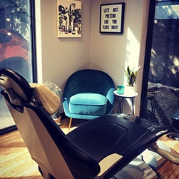 Dental exam room with sunlight streaming in through windows