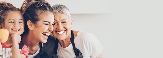 Three generations of woman laughing together