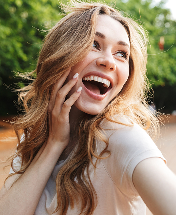 Woman in white shirt laughing