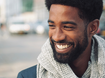 Close up of smiling man with scarf