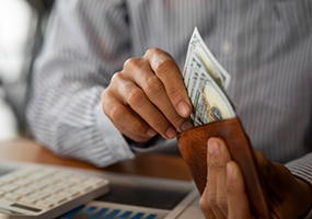 Taking money out of wallet