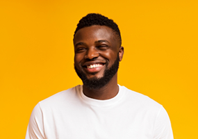 Man in white shirt smiling