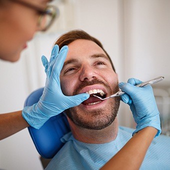 Man receiving dental exam