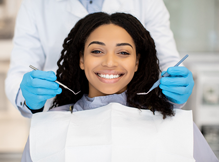 Woman in dental chair smiling