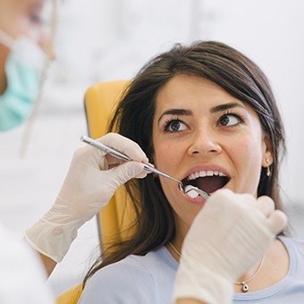 Woman receiving dental exam